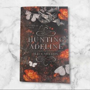 'Hunting Adeline' Book with Black and Orange Cover